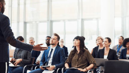 people listening to a speech